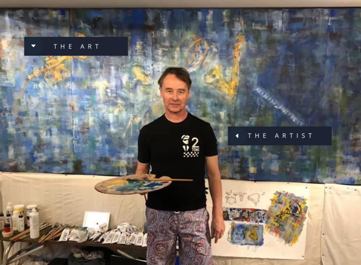 Jono Pye in front of one of his larger abstract paintings.